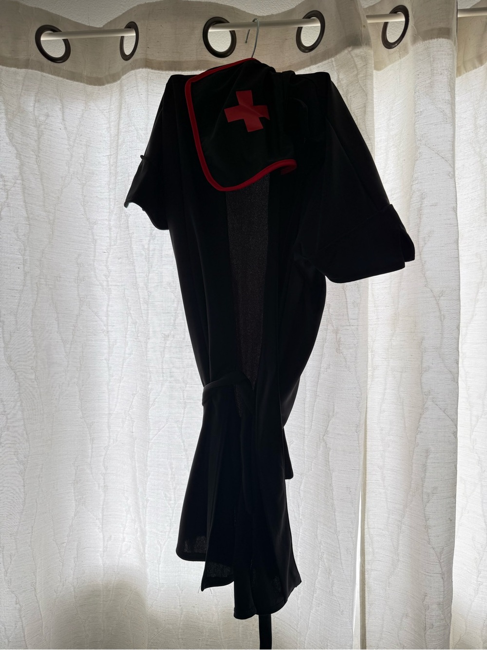 Black Nurse-Inspired Wrap Dress with Red Trim